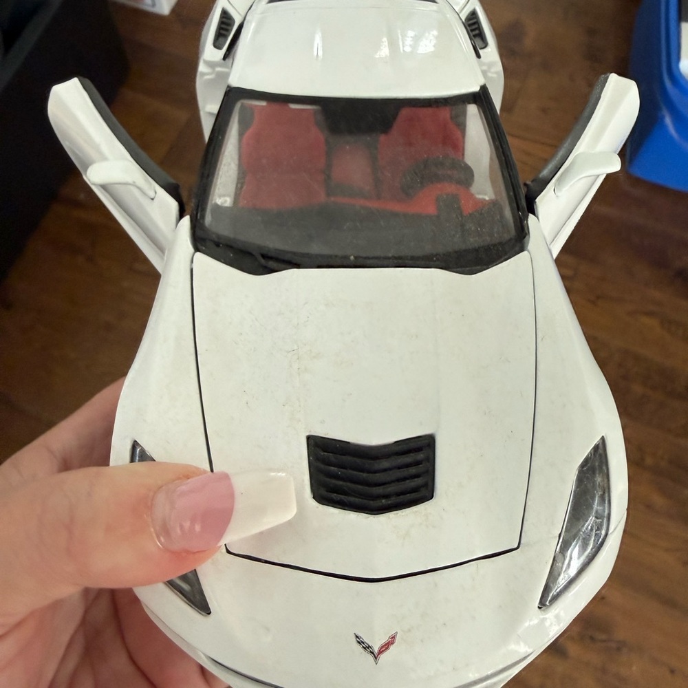 White Corvette Model Car with Red Interior